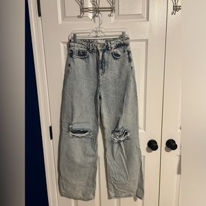 Light/Dark washed jeans with rips on the knees. Brand is Zara and size is 06.